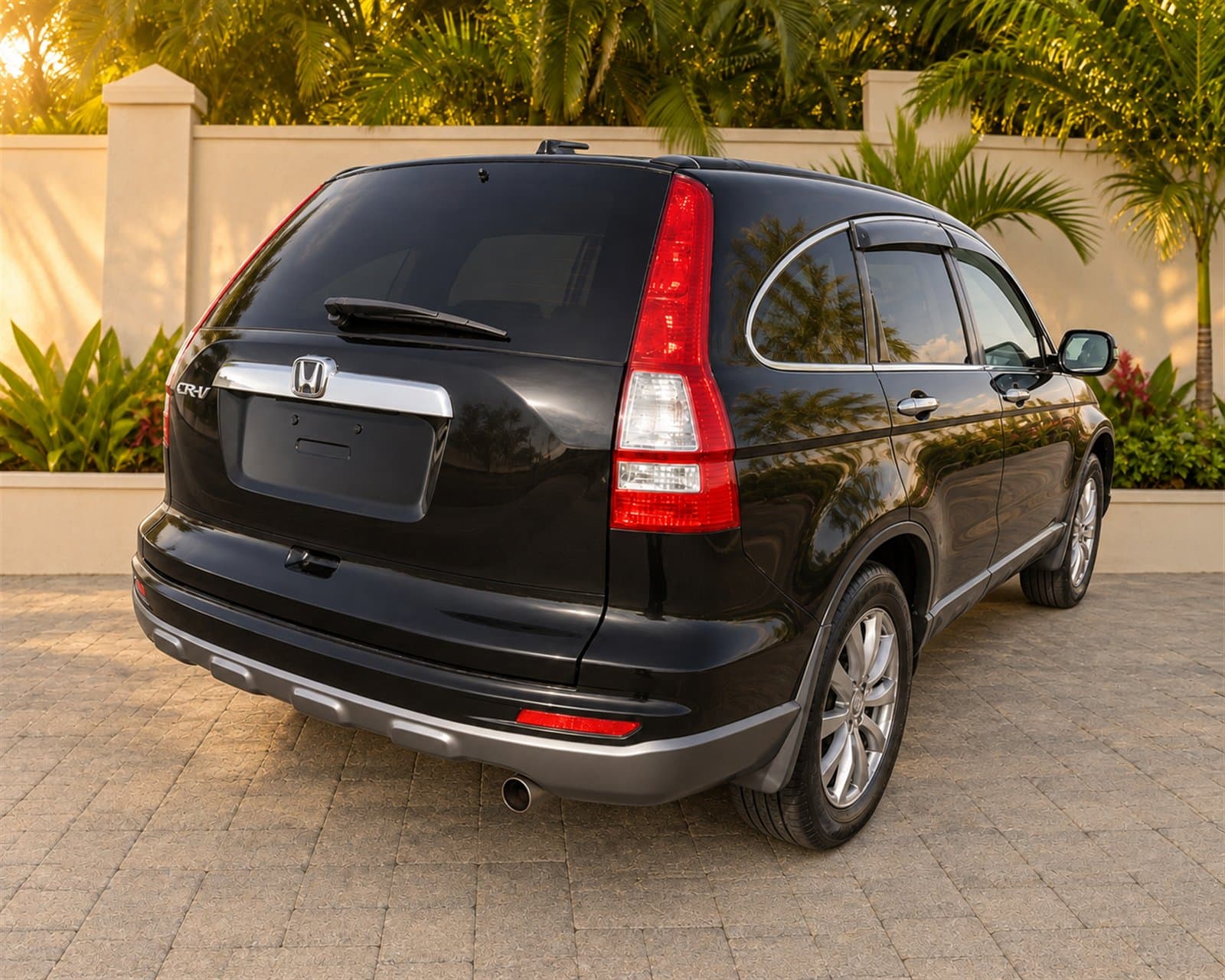 Rear three-quarter view of the dark Honda CR-V