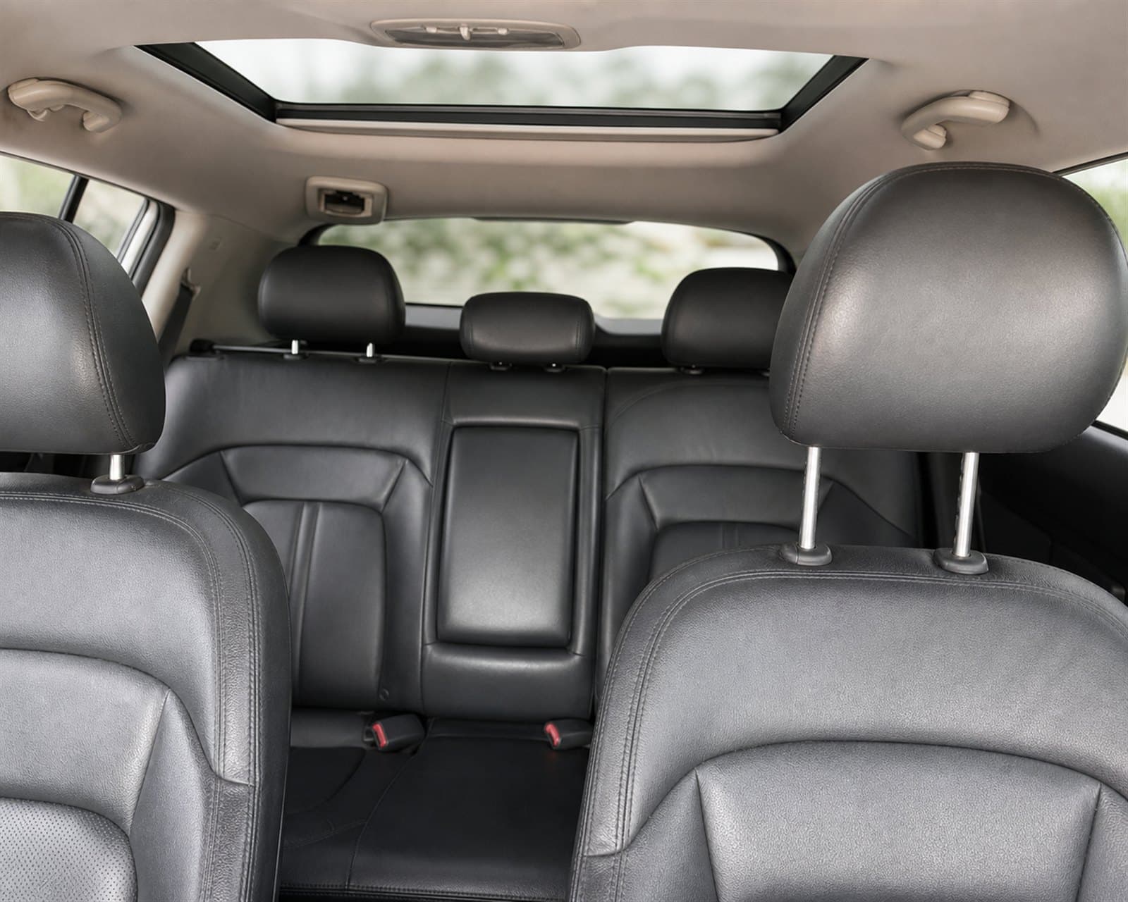 Black leather seating and sunroof inside the Kia Sportage