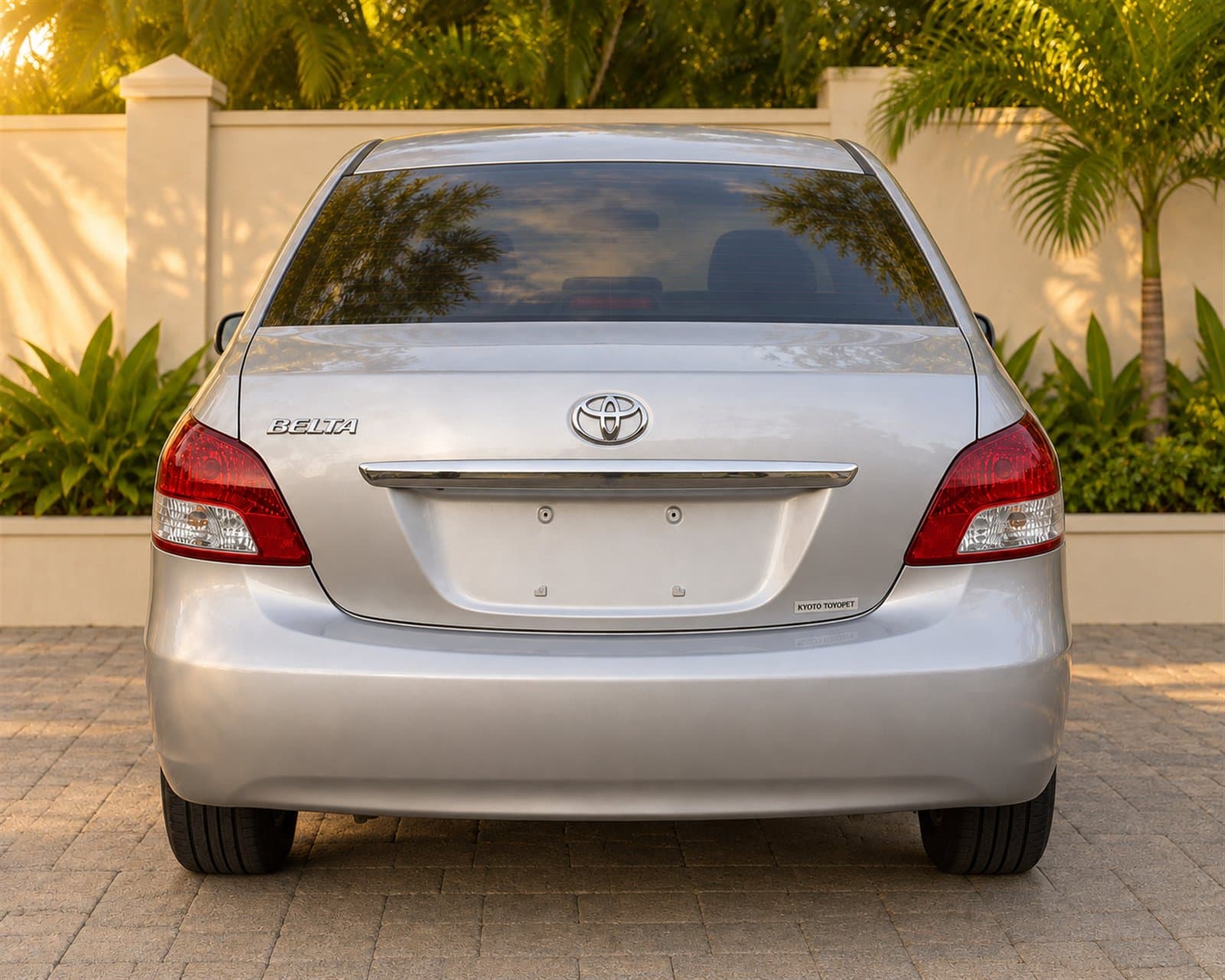 Rear view of the silver Toyota Belta