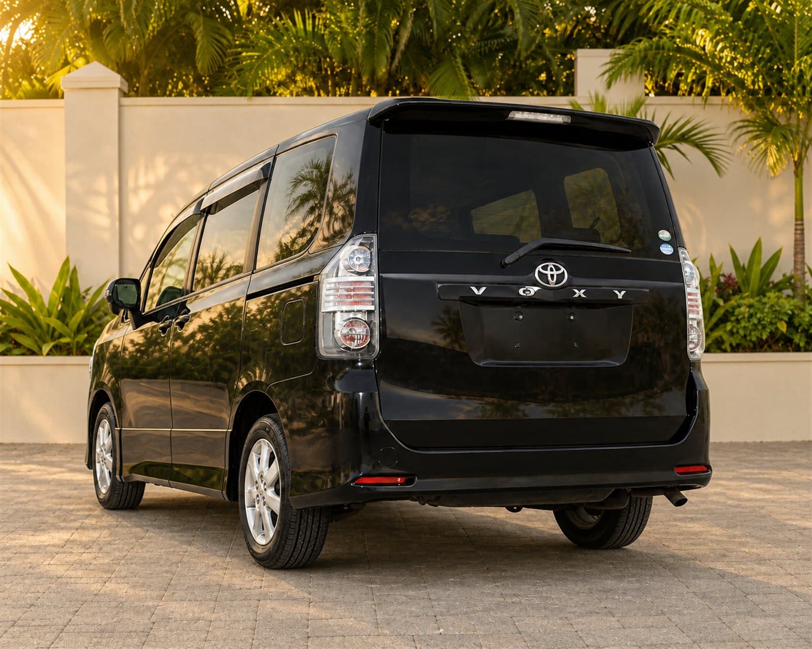 Rear three-quarter view of the black Toyota Voxy